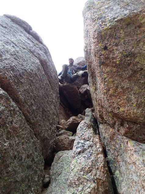 climbing down jagged pass.